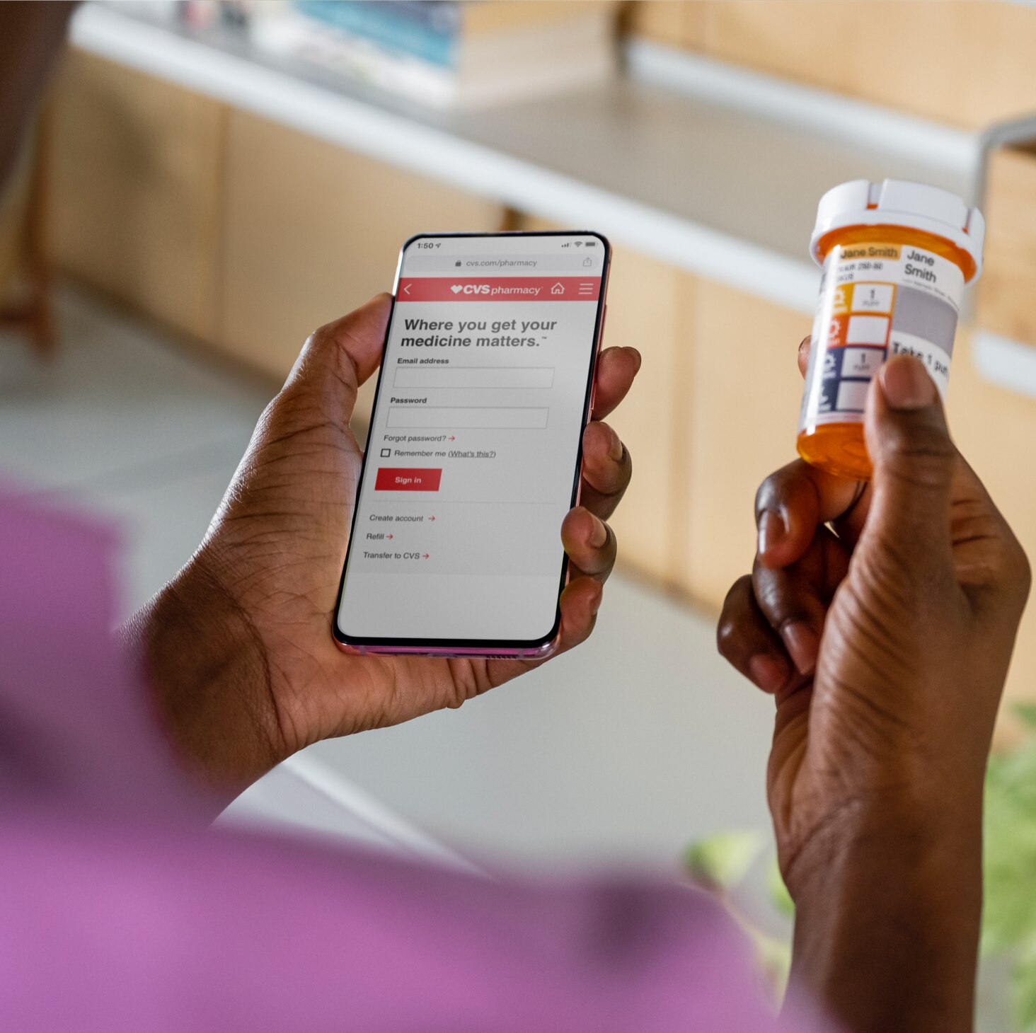 Patient comparing prescription bottle with information found on the CVS app. Learn more about prescription services now.